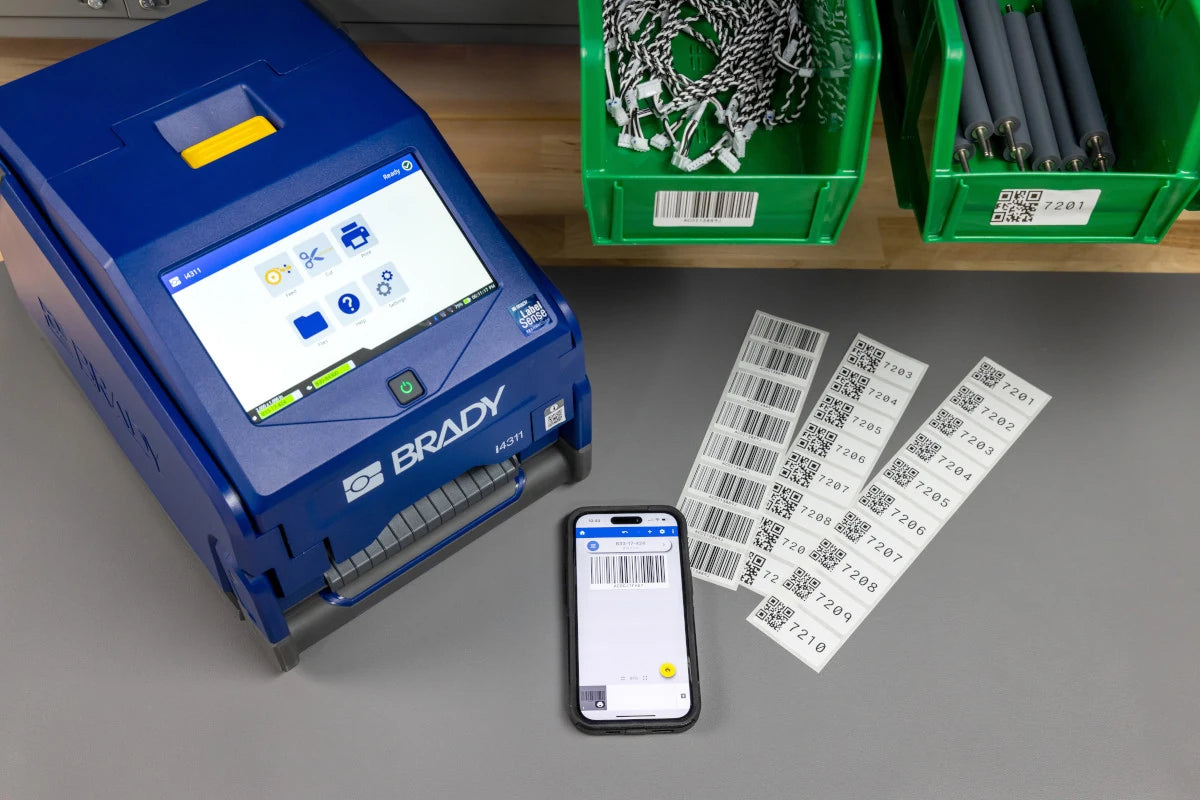 Brady i4311 with label rolls, printed labels and a connected smartphone